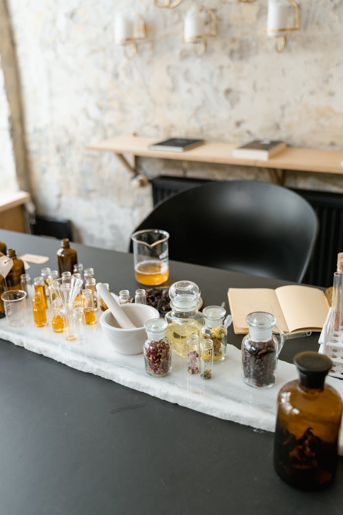 A sophisticated arrangement of aromatic oils, herbs, and natural ingredients for wellness and relaxation.